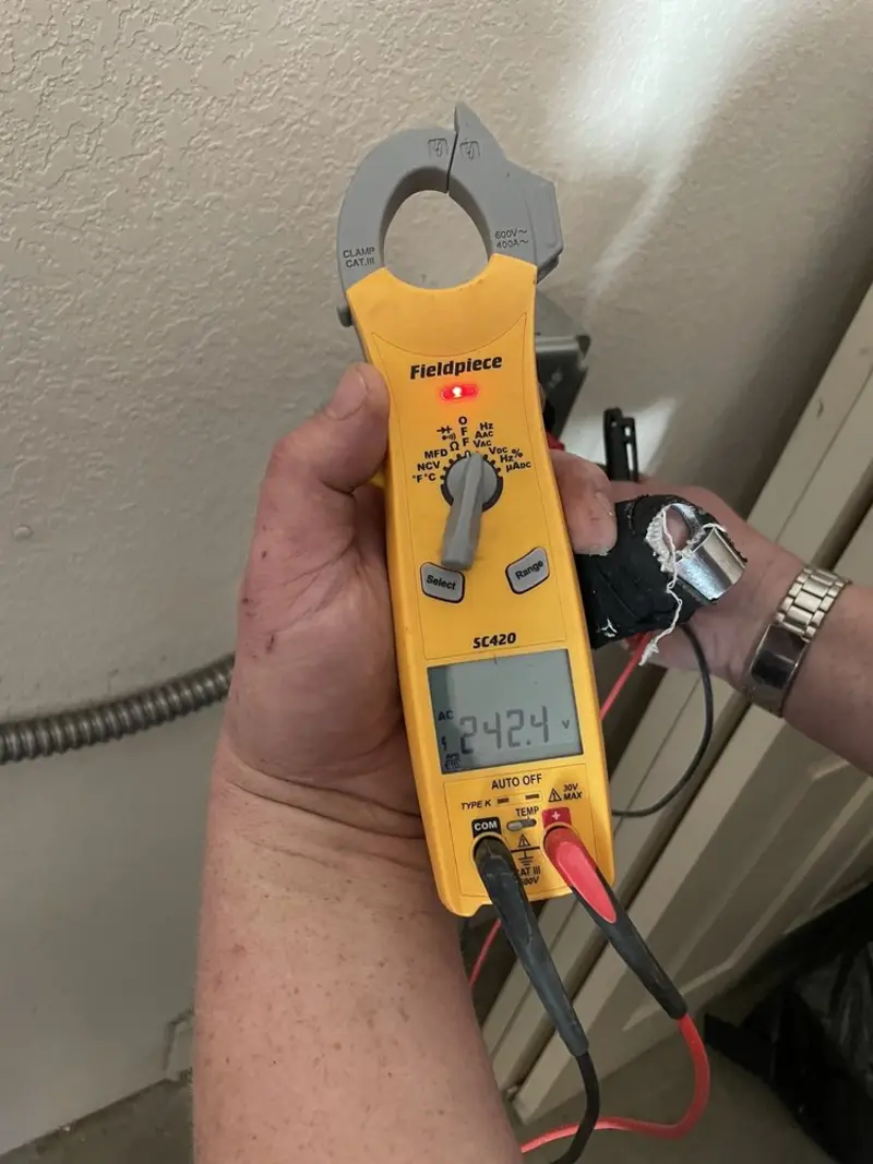 Voltage testing with clamp meter during Electrical Installation Services in Unicoi